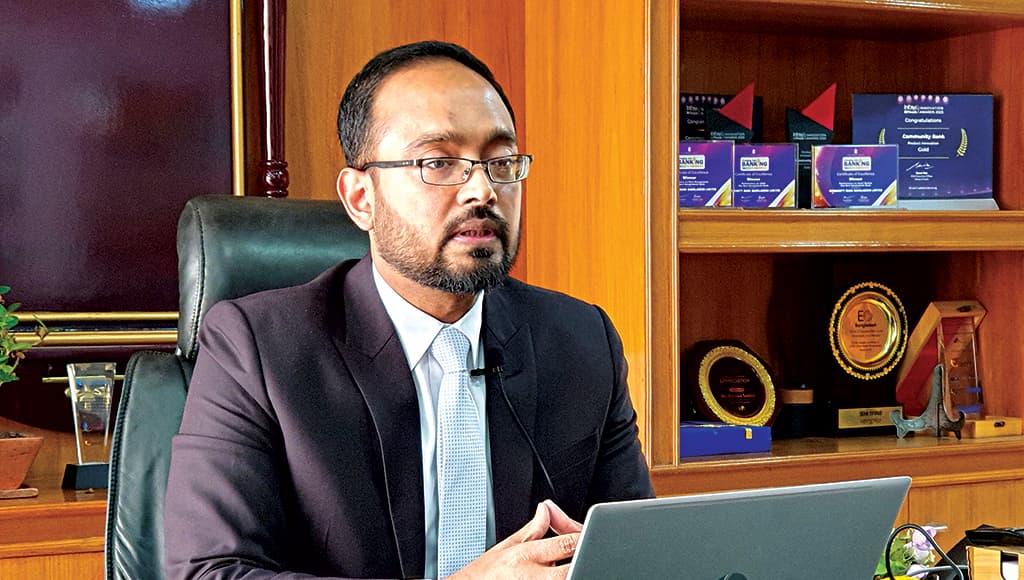 Kimiwa Saddat at his desk